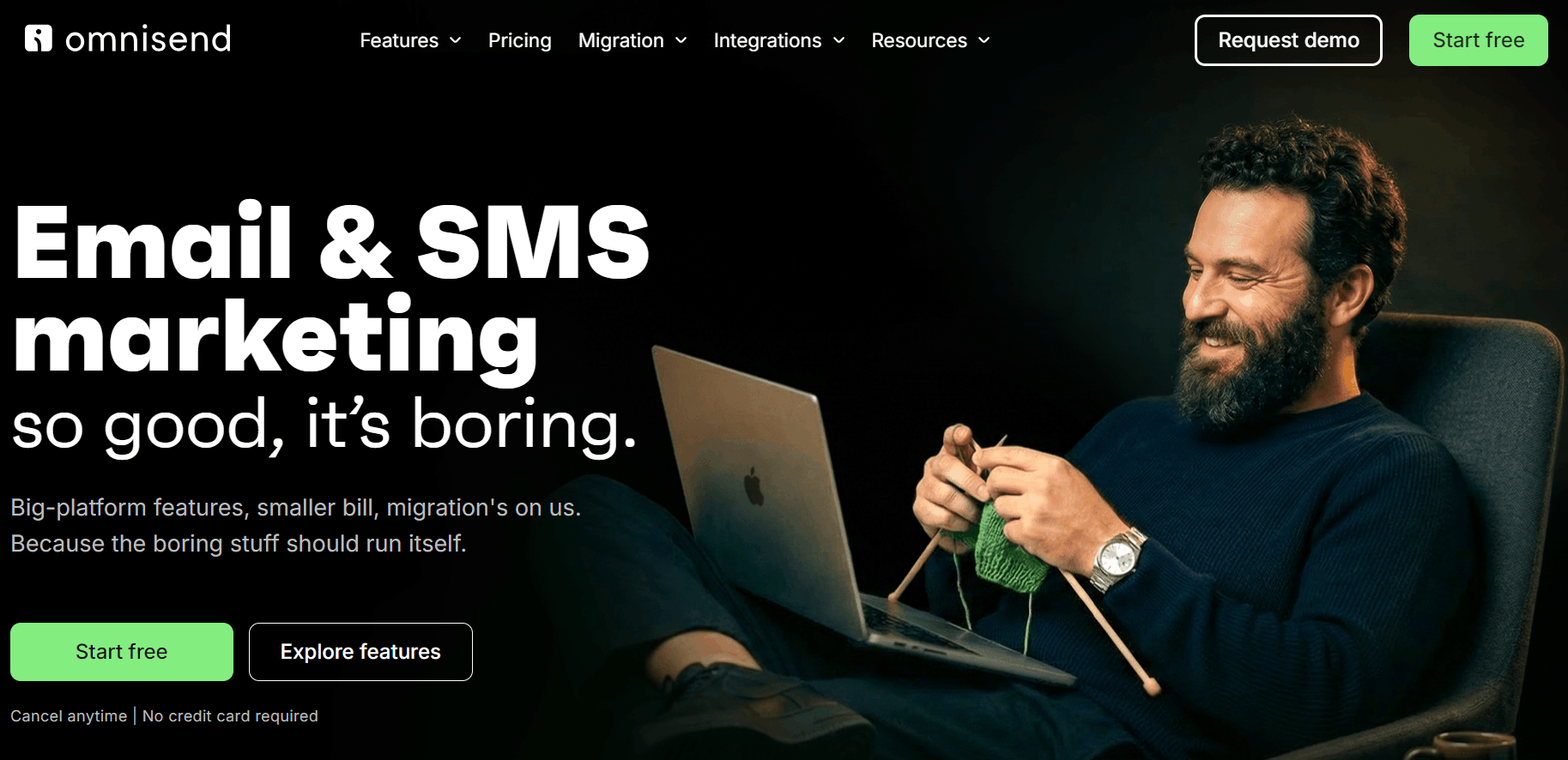 Nonprofit email marketing: A bearded man smiles while knitting and using a laptop. Large white text says Email & SMS marketing so good, it’s boring. The website header and buttons are also visible.